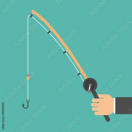 Hand holding fishing rod 