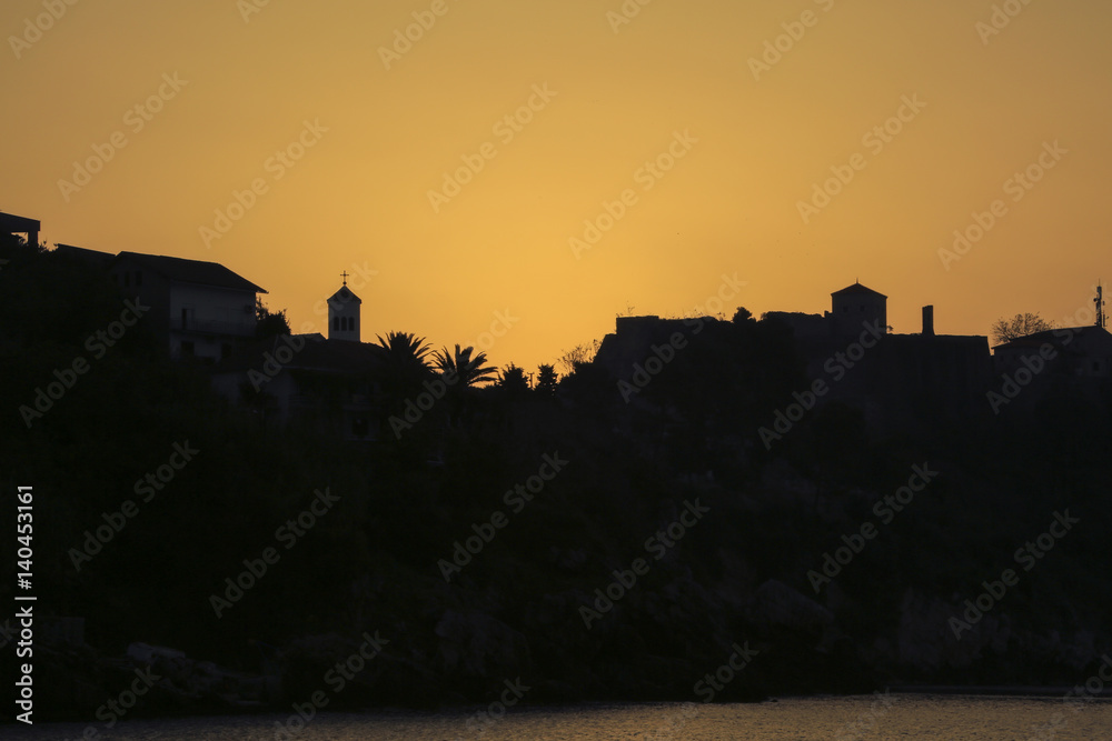 The silhouette of the old town at dawn.