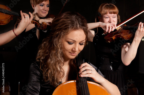 Musician play violin on dark