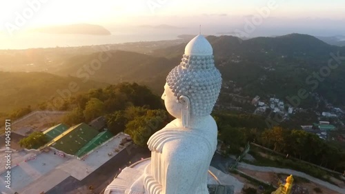 Beautiful Golden Sunrise at White Big Buddha Statue Temple. HD Aerial View. Phuket, Thailand. photo