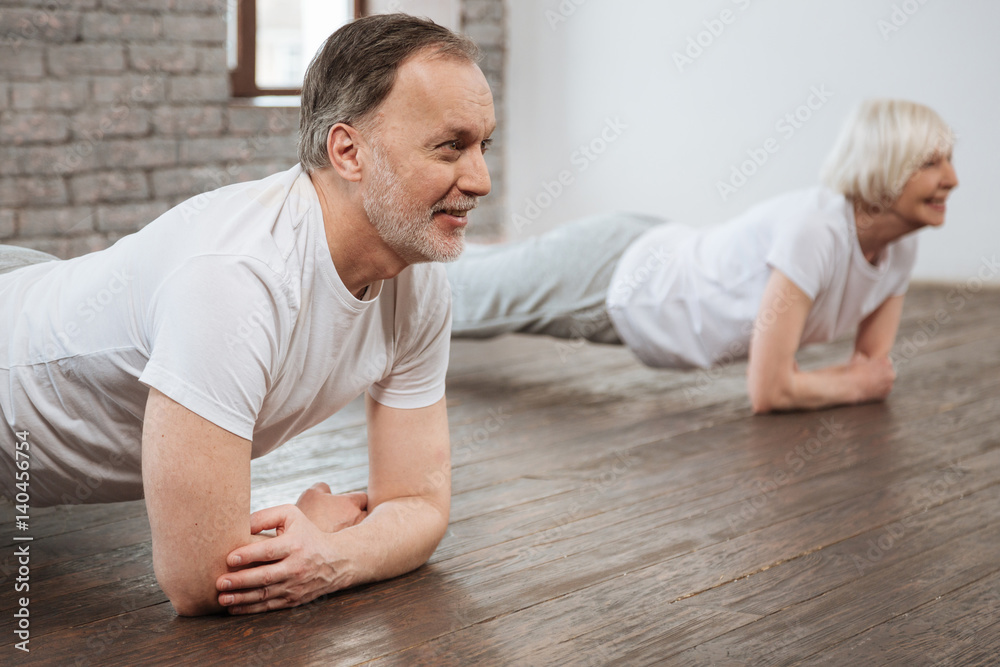 Positive delighted male person while training Positive delighted male person while training