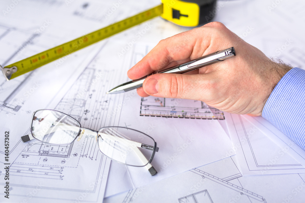 Construction plans on blueprints and measure Construction plans on blueprints and measure