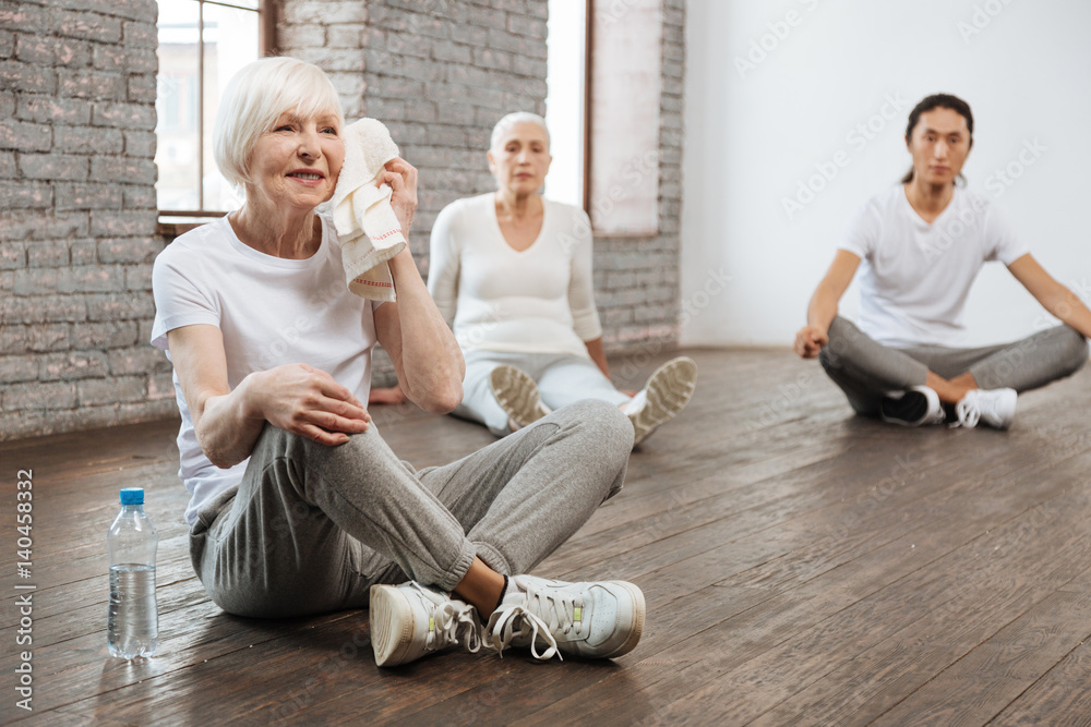 Attractive old female resting on the floor Attractive old female resting on the floor