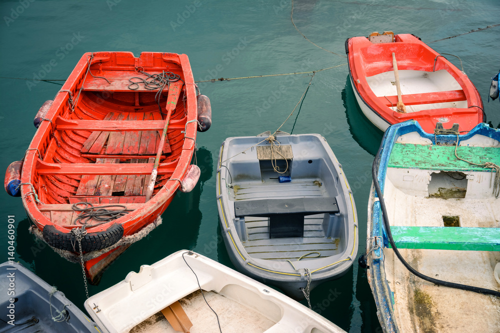 disordered wooden boats at dock disordered wooden boats at dock