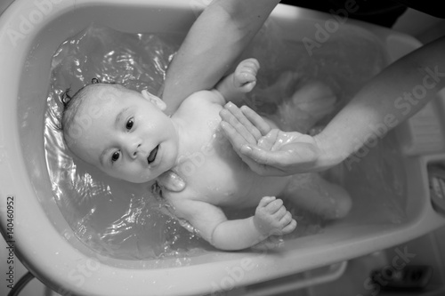  Bathing beautiful newborn baby boy 
