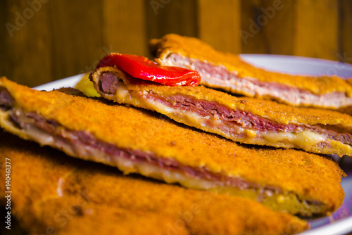 Delicious typical breaded and filled veal meat - Asturian cachopo photo