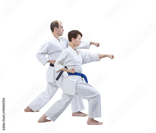 Brother and sister hit a punch on a white background isolated