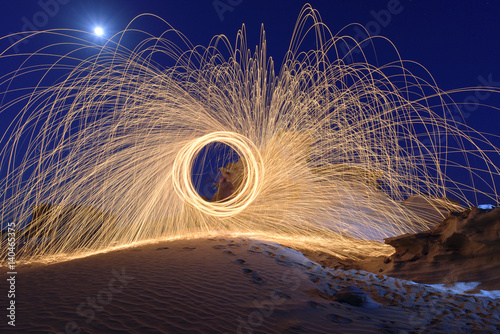 Burning Steel Wool spinning. Showers of glowing sparks from spinning steel wool
