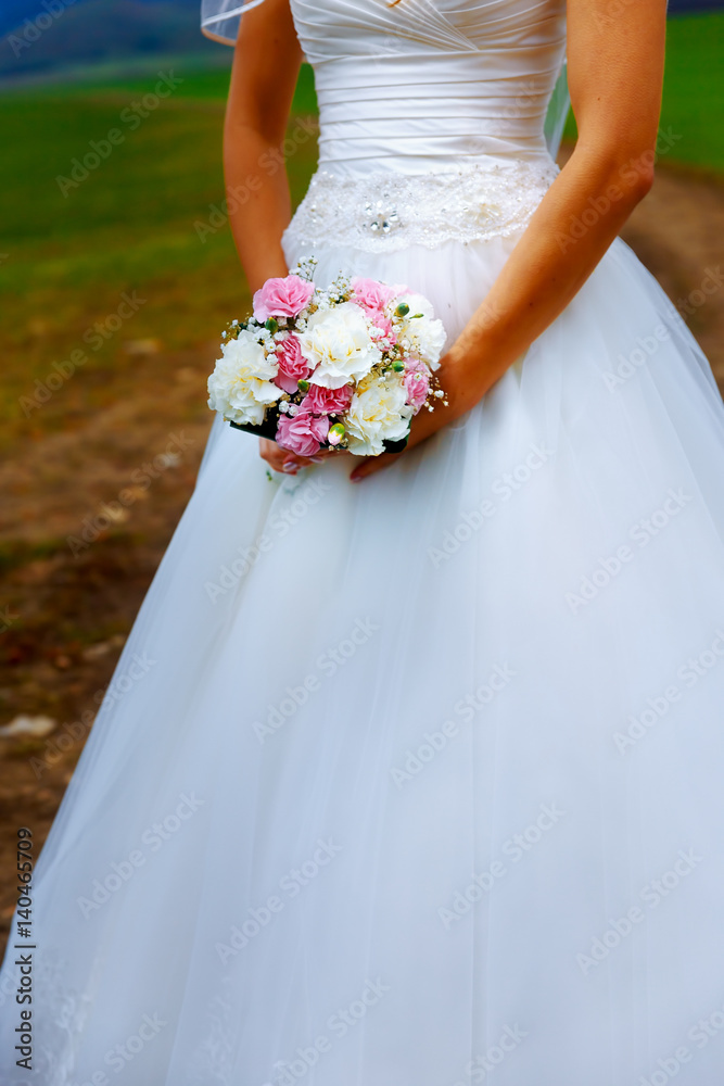 Beautiful wedding bouquet in hands of the bride. Beautiful wedding bouquet in hands of the bride.