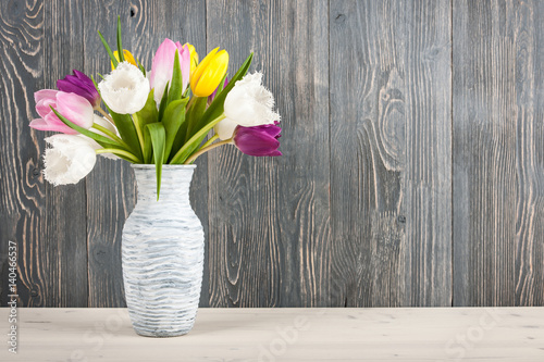 Fresh colorful tulips bouquet in jug