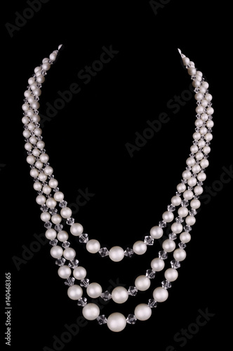  White pearls luxury necklace on black background