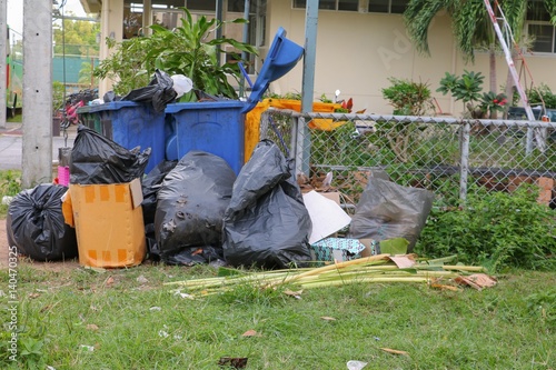 Pile black garbage bag roadside in the city