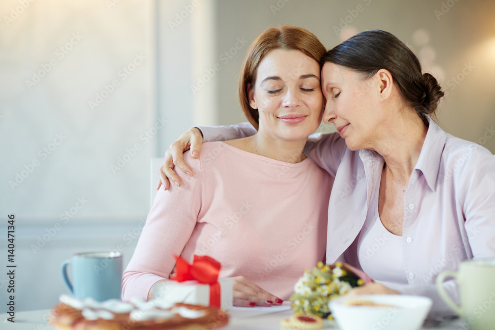 Senior woman embracing her daughter during celebration of mother day Senior woman embracing her daughter during celebration of mother day