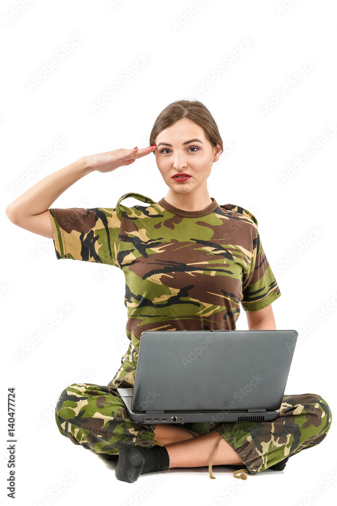 beautiful young woman soldier in military camouflage outfit