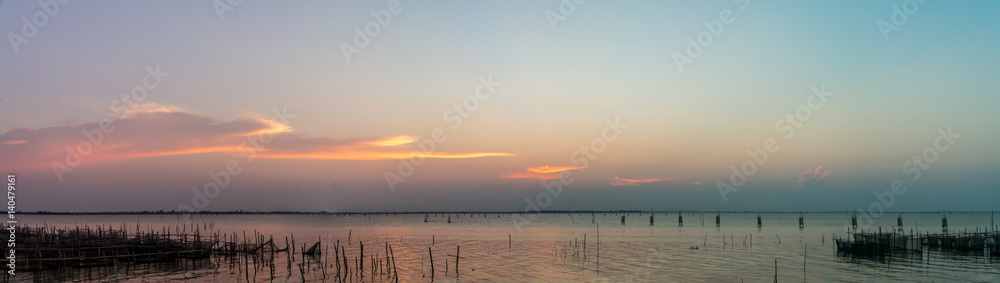 Panorama photo of Songkhla lake view with colorfull sky from south of Ko Yo island, Songkhla, South Thailand.