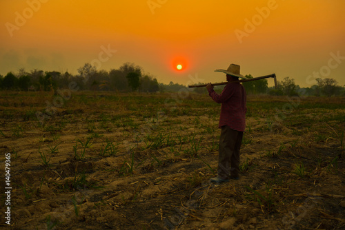 Male farmer holding a shovel