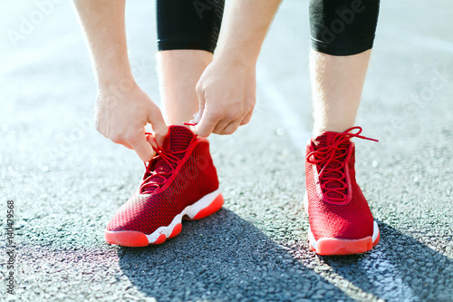 Man in red sneakers © veles_studio
