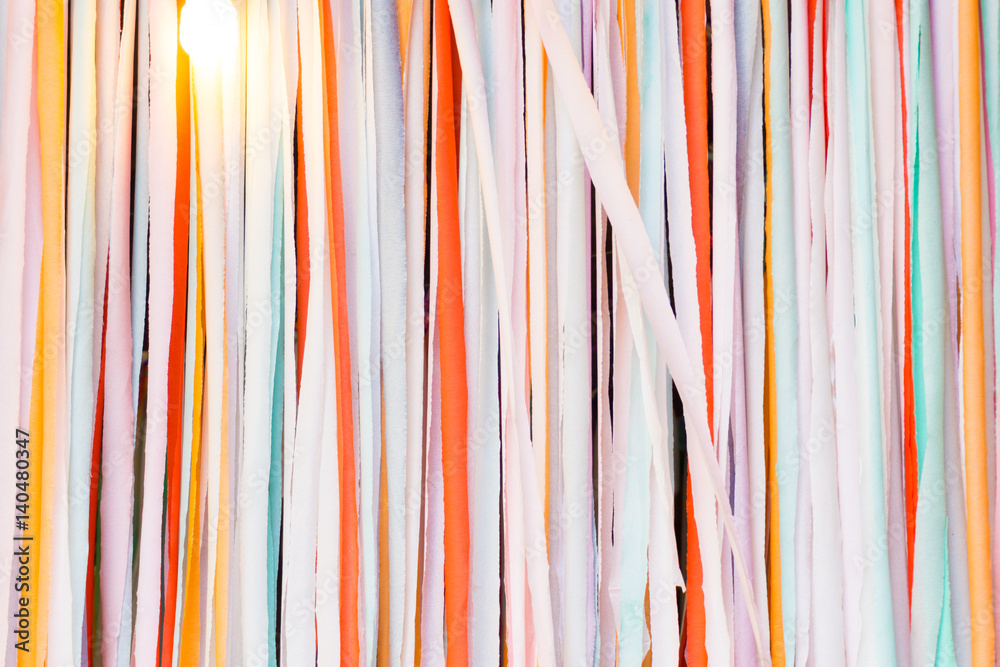 colorful fabric hanging on the wall with light bulb colorful fabric hanging on the wall with light bulb