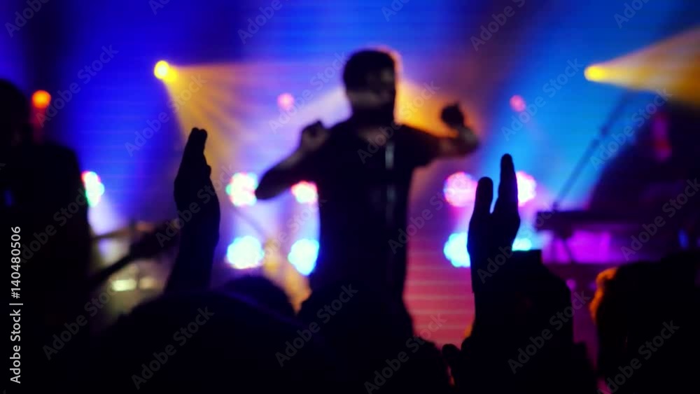 Fans waving their hands at rock concert in night club. 3840x2160 Fans waving their hands at rock concert in night club. 3840x2160