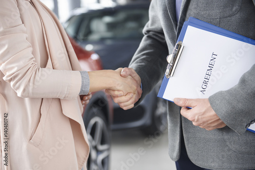 Close up of handshake customer and salesman.