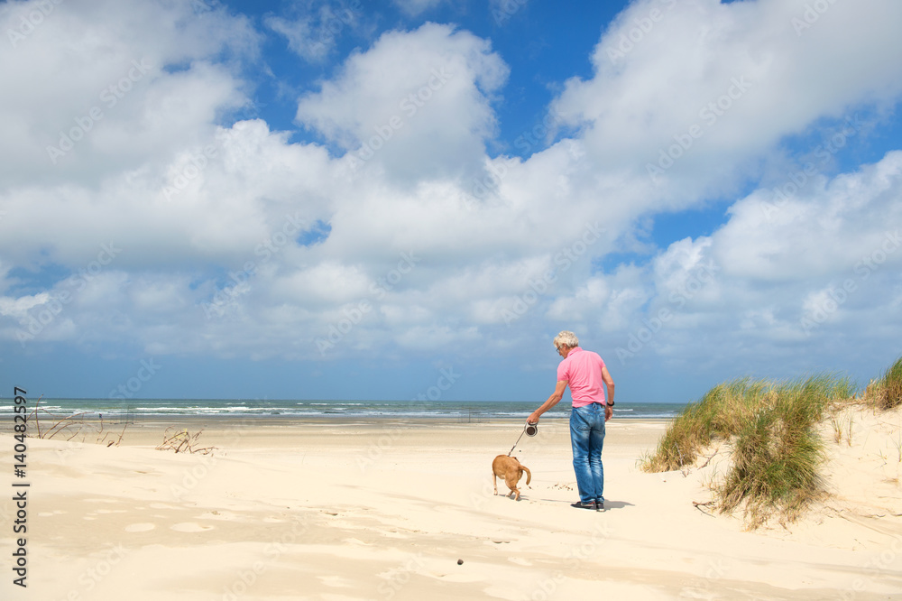 Man with dog at the beach Man with dog at the beach