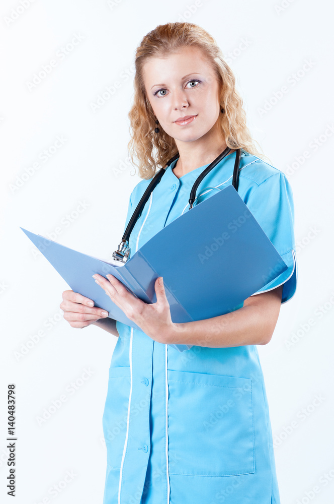 Beautiful young doctor with file folder and stethoscope in hospital Beautiful young doctor with file folder and stethoscope in hospital