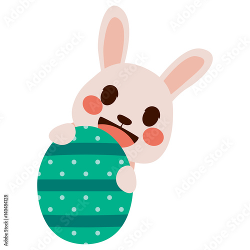 Cute little pink Easter bunny hiding behind decorated egg