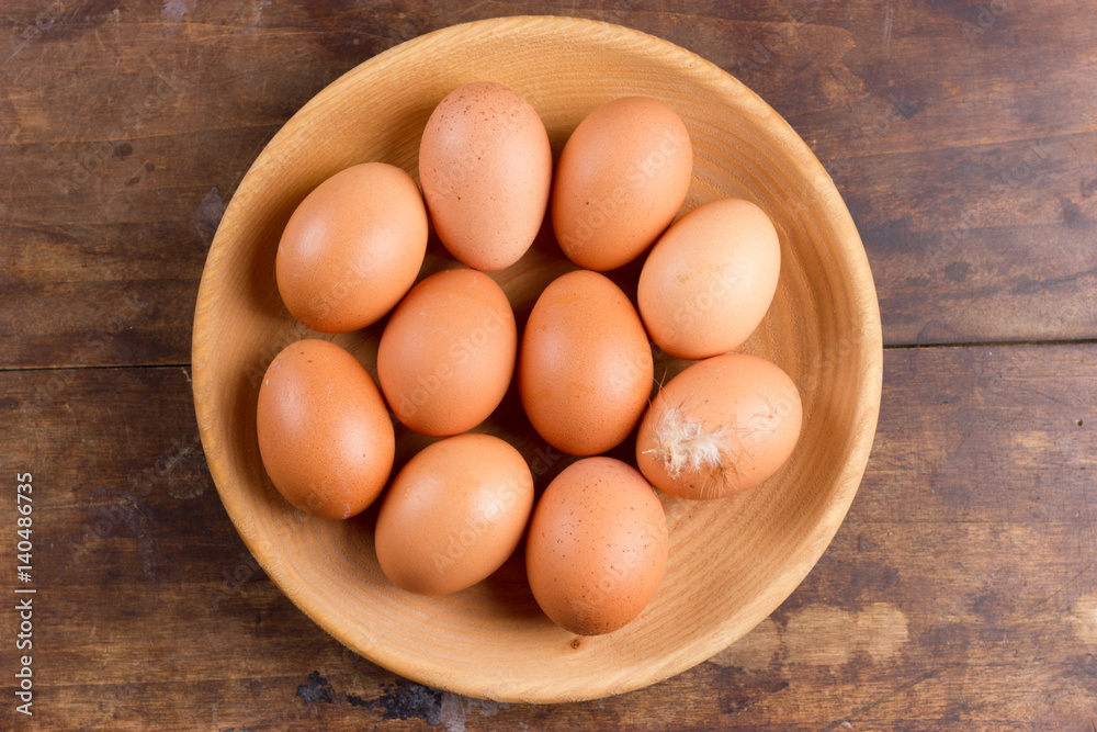Eggs on wooden plate Eggs on wooden plate
