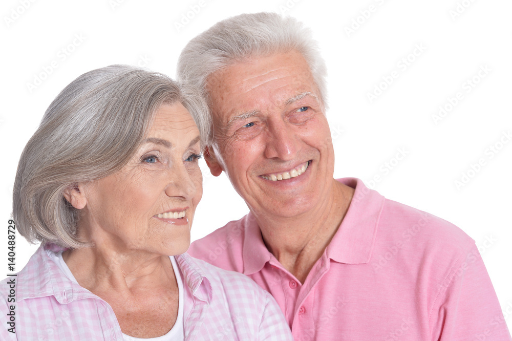 Happy old couple embracing on a white background Happy old couple embracing on a white background