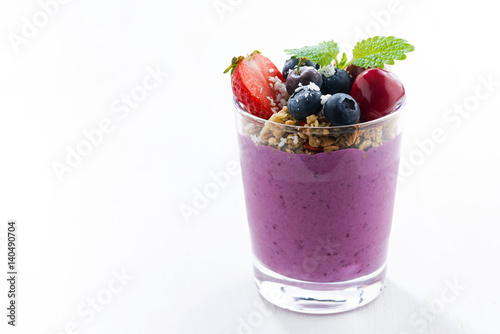 blueberry yogurt with granola on a white background, closeup