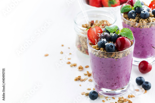 Blueberry dessert with fresh berries and granola and white background