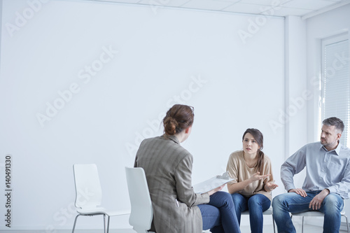Married couple talking with therapist