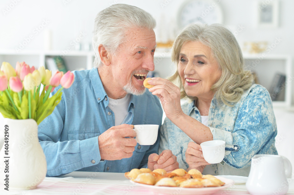Beautiful elderly couple having breakfast