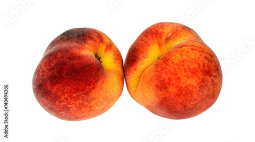 two red ripe juicy peach on background