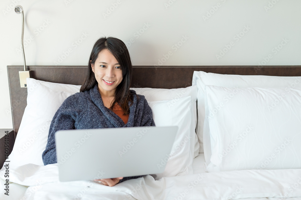 Woman working on laptop computer at home Woman working on laptop computer at home