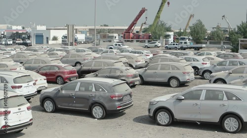 Lot Full of Brand New Cars, Recently Arrived in Shipping for Local Delivery photo