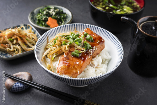 Traditional Japanese Salmon Teriyaki with Rice and Vegetable as close-up in a bowl