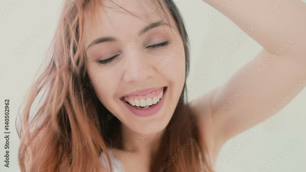 Beautiful woman taking selfie, using phone in the bedroom. Smiling and happy female enjoying the day. Slow motion. Beautiful woman taking selfie, using phone in the bedroom. Smiling and happy female enjoying the day. Slow motion.