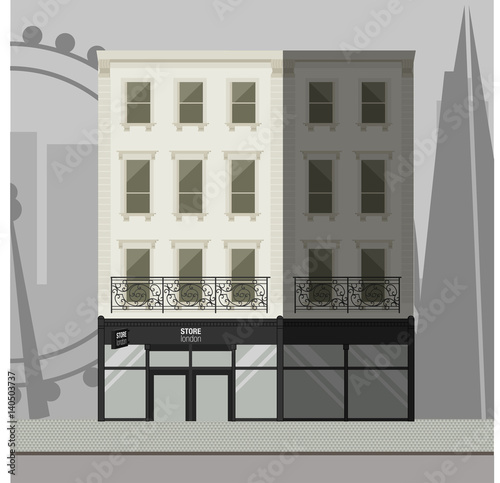 White apartment building with a balcony and a store in the ground floor.