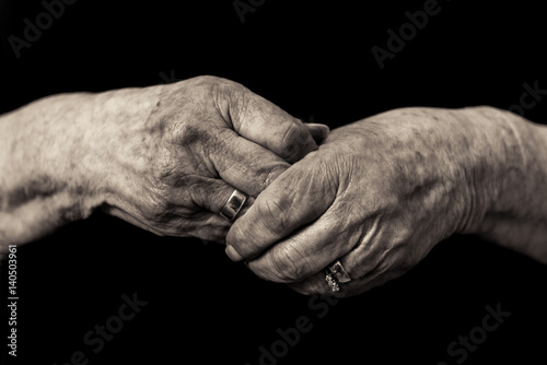 Older lady's hands. Widows grief in old age concept