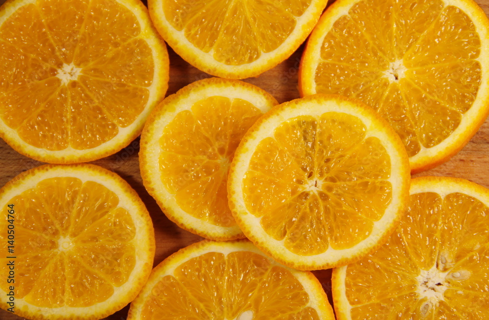 Fototapeta premium Background of sliced juicy oranges fruit