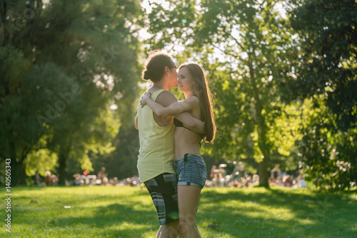 Man and woman dancing Latin American in park