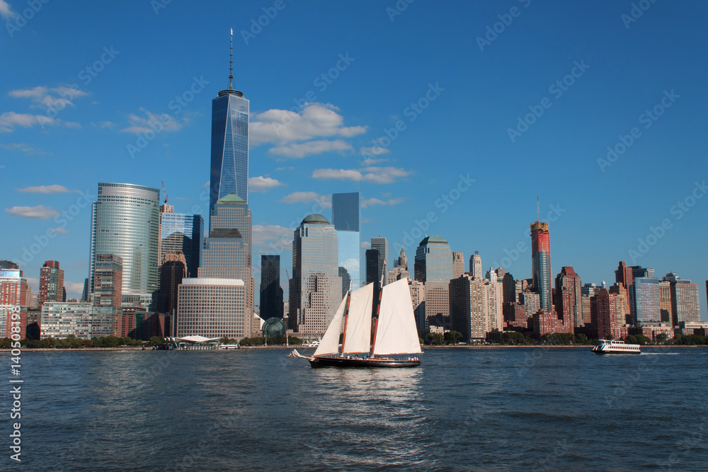 Lower Manhattan cityscape with sailing ship