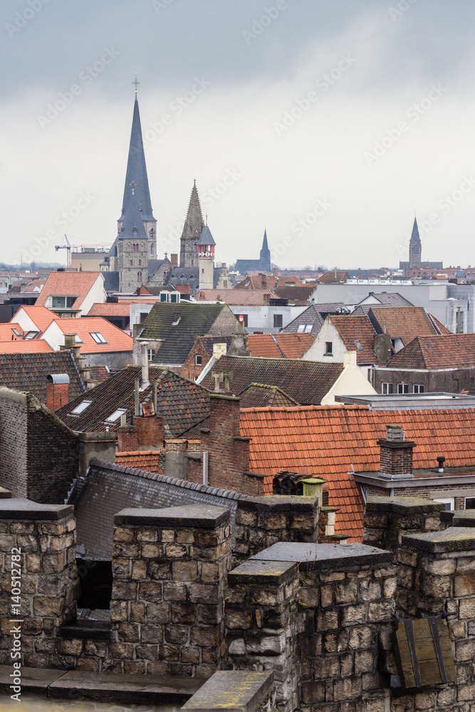 Cityscape of architecture of streets of Gent town, Belgium in rainy day