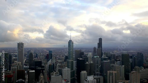 view through window at downtown in chicago with trump tower in background with fast coming cloud and darkening sky wth rain