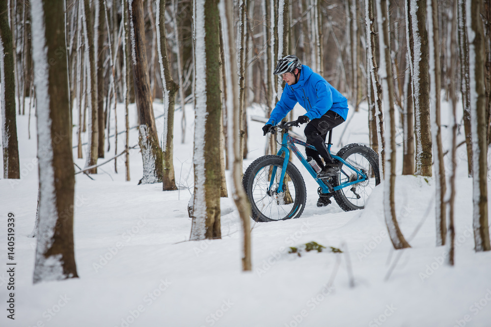 Fat biker riding in the snow