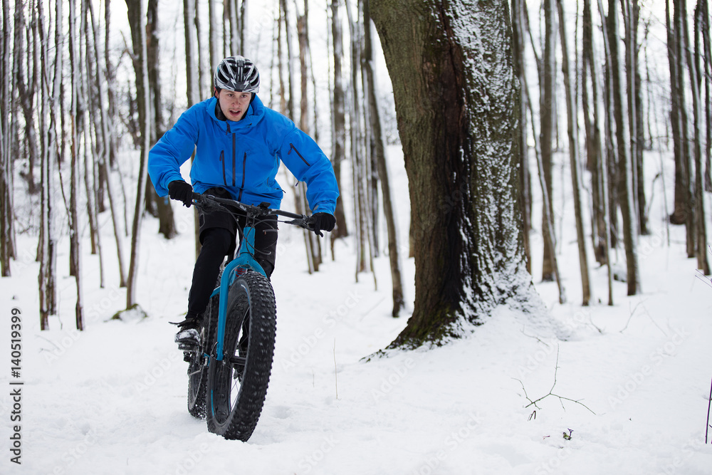 Fat biker riding in the snow