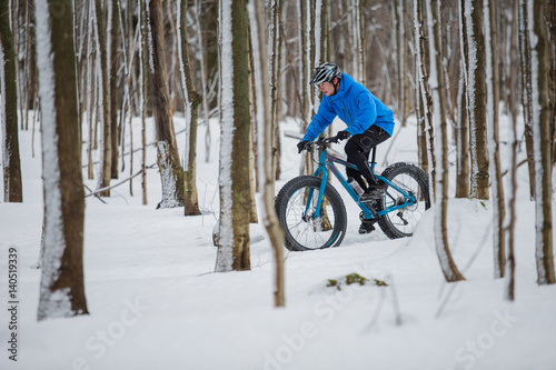 Fat biker riding in the snow