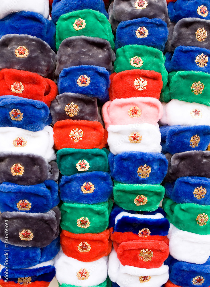 Multicolored caps with Soviet cockades are sold in the center of Moscow for tourists. Multicolored caps with Soviet cockades are sold in the center of Moscow for tourists.