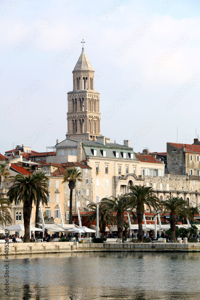 Eclectic mix of historic architecture on The Riva promenade in Split, Croatia. Saint Domnius bell tower in the background. Split is popular tourist destination and UNESCO World Heritage Site. 